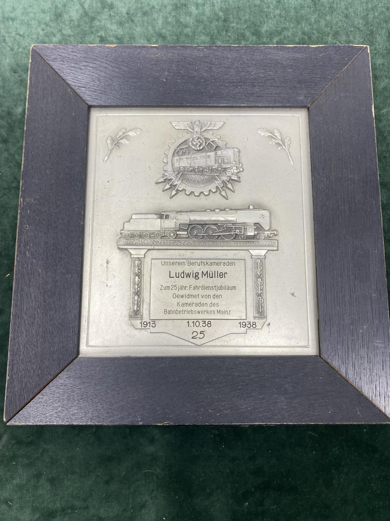 A THIRD REICH RAILWAY 25 YEAR FRAMED LONG SERVICE AWARD PLAQUE IN METAL.