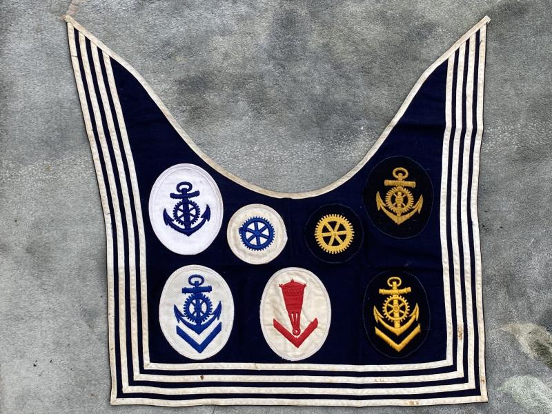 A THIRD REICH NAVY ‘DICKY’ or NECK SCARF. COMPLETE WITH 7 ORIGINAL SPECIALIST CLOTH BADGES.