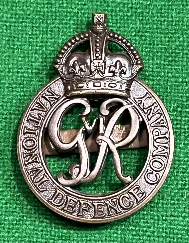 National Defence Company O.S.D cap badge.