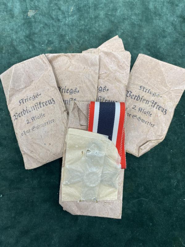 ORIGINAL THIRD REICH WAR MERIT CROSSES IN FACTORY ENVELOPES AND PAPER. MINT UNISSUED.