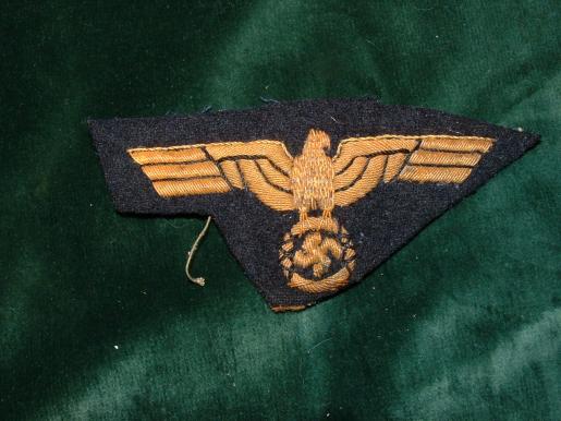 GOLD THIRD REICH NAVY OFFICERS BREAST EAGLE ON UNCUT BACKING.