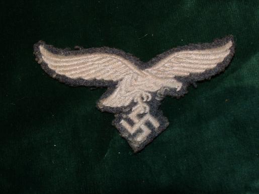 LUFTWAFFE BREAST EAGLE REMOVED FROM TUNIC.