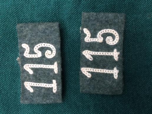 PAIR OF THIRD REICH SLIP ON REGIMENTAL NUMBERS.