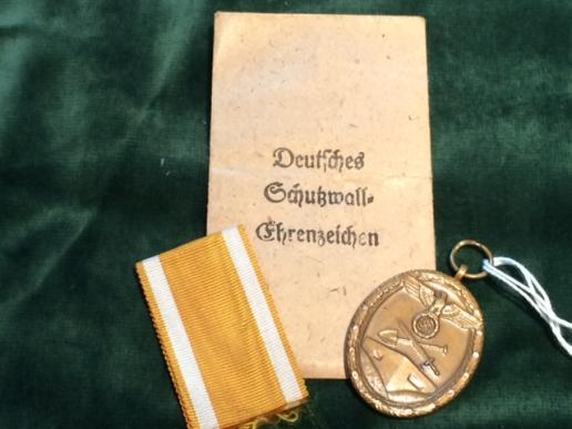 WEST WALL MEDAL IN ORIGINAL PAPER PACKET.