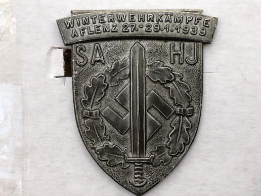 HITLER YOUTH COMMEMORATIVE SPORTS DAY BADGE WITH THE SA IN 1939.