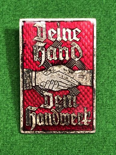 German ' Deine Hand Den Handwerk ' badge.