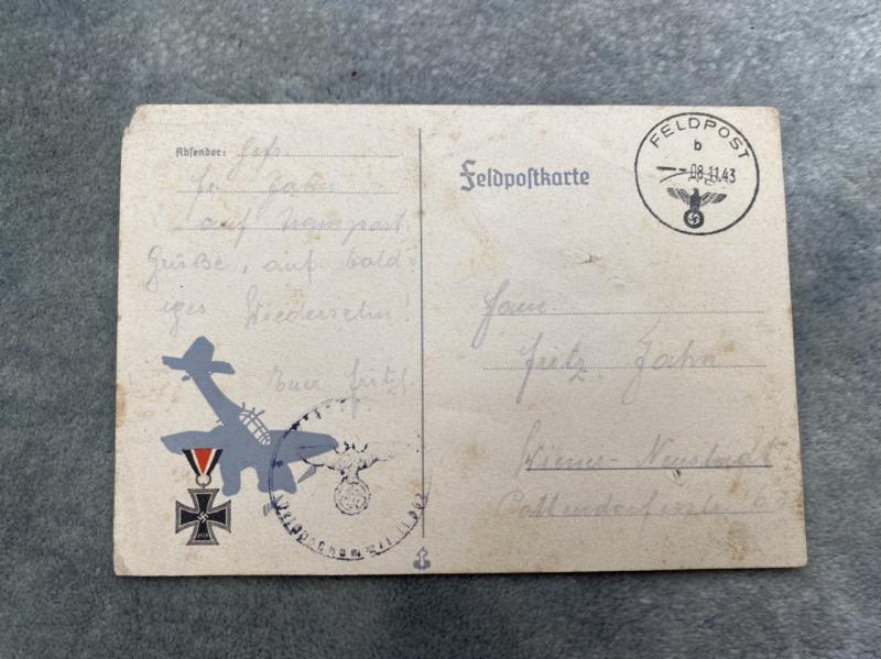 A COMPLETED FELDPOSTKARTE FEATURING A STUKA IN 1943.